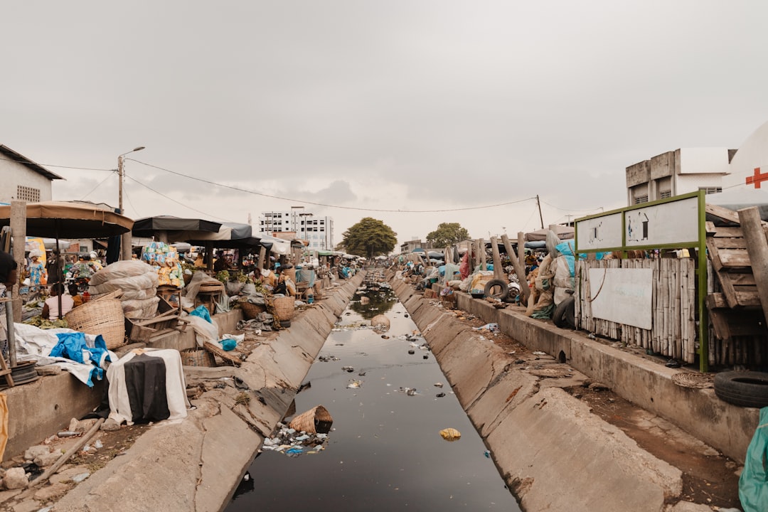 contact-img a-dirty-polluted-waterway-winds-through-a-market-t-xad9vvpmi